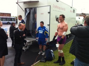 BBC sports rep Richard Askam and Warrington Wolves Adrian Morley outside freeze chamber at Bolton Uni
